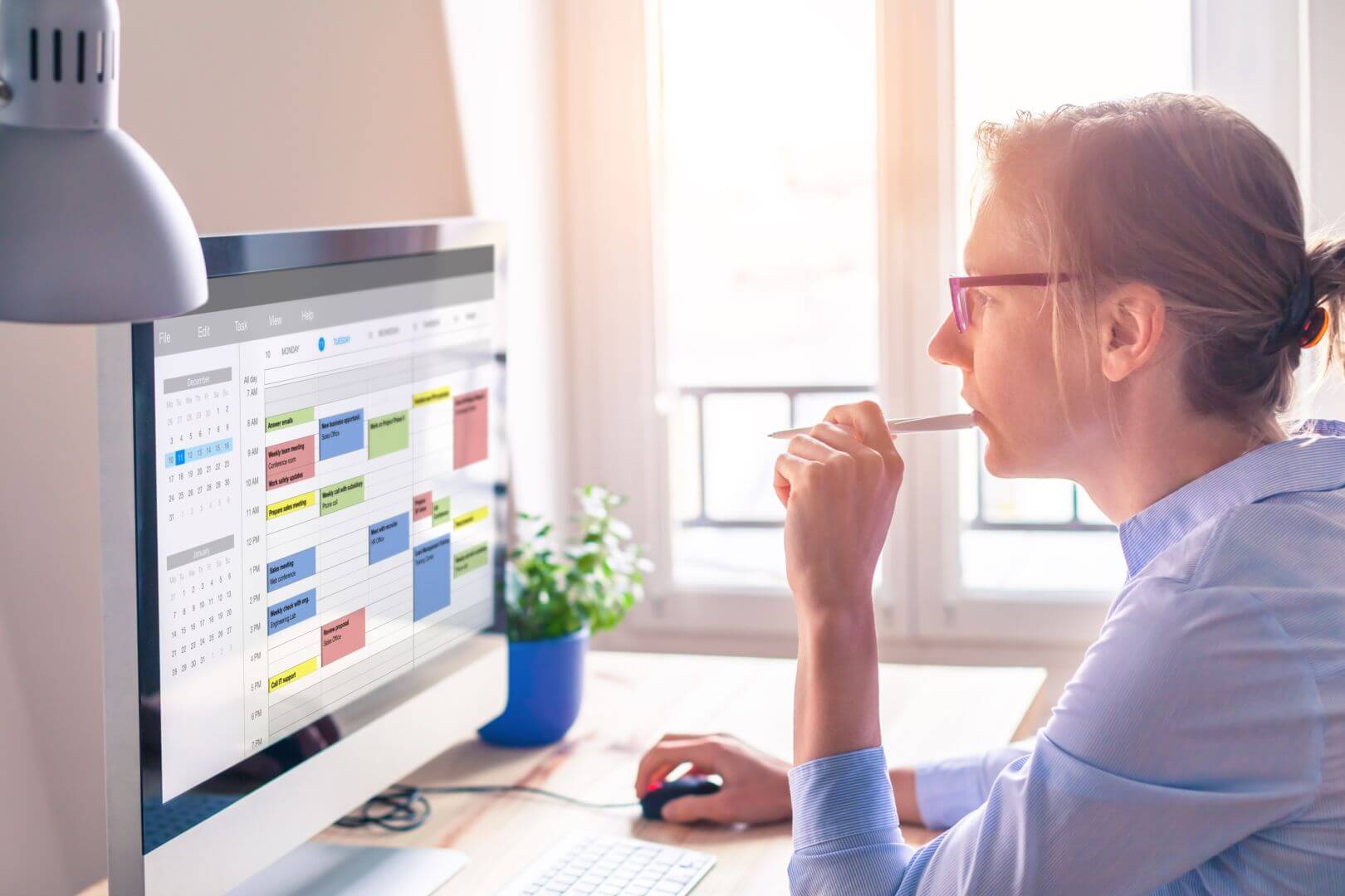 Photograph of woman looking at her online calendar